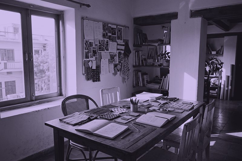 A meeting room with sketchbooks and samples